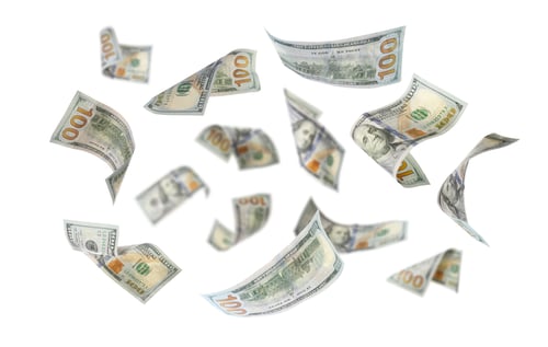 Preview: Money (dollar bills) flying in air against white background