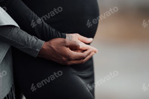 Preview: Young beautiful interracial millennial couple expecting a baby.