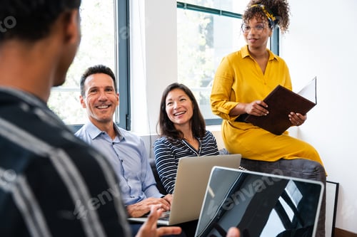 Preview: Business people collaborating during meeting in modern office