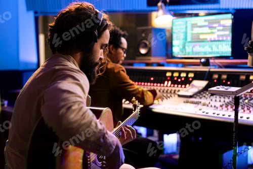 Preview: Man Plays Acoustic Guitar in Music Recording Studio