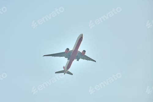 Preview: Airplane flying in blue sky copy space, large passenger plane flies in blue sky