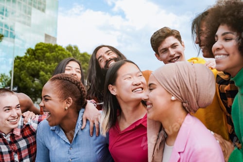 Preview: Happy group of people having fun in city. Young students enjoy together hugging