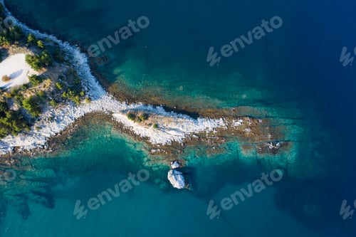 Preview: Aerial drone view of a remote rocky peninsula in Greece.