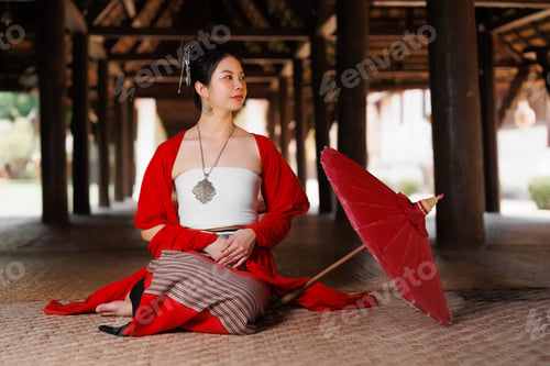Preview: Northern Thai Chiangmai lanna style beautiful women with paper umbrella at wat ton kwen