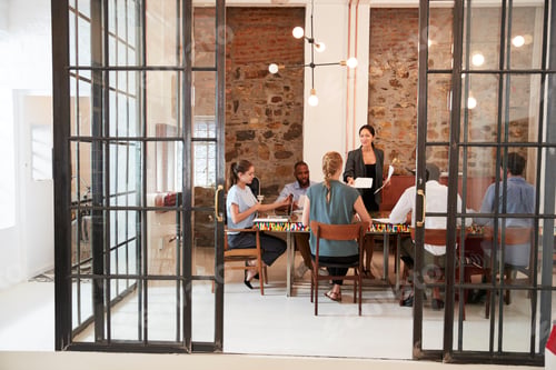 Preview: Creative business team in discussion in a meeting room