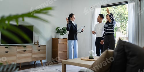 Preview: young couple with a real estate agent visiting home for buy or for rent