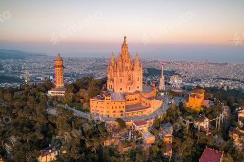 Preview: Aerial view of Barcelona skyline with Sagrat Cor temple during sunset, Catalonia, Spain
