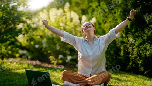 Preview: woman working on laptop in summer morning