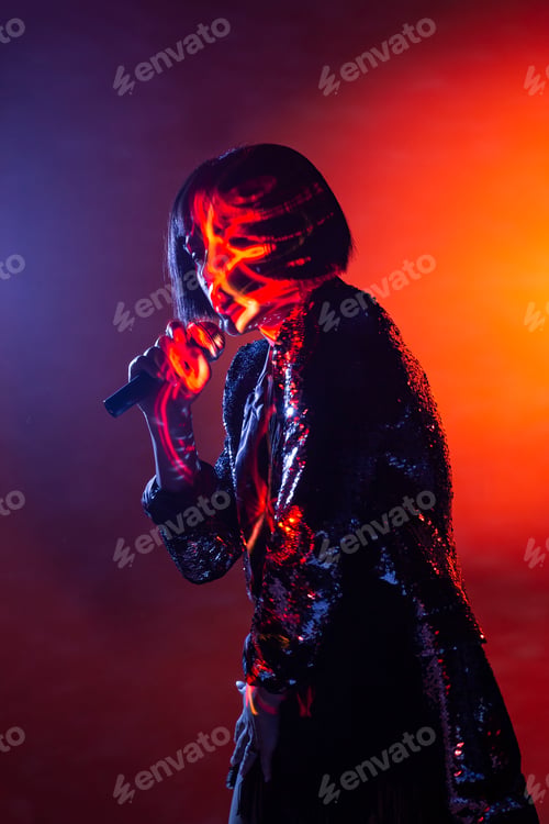 Preview: Stylish woman singing on stage