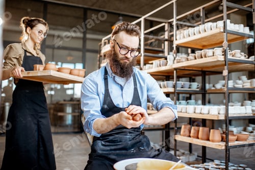 Preview: Potter making jugs with pottery wheel