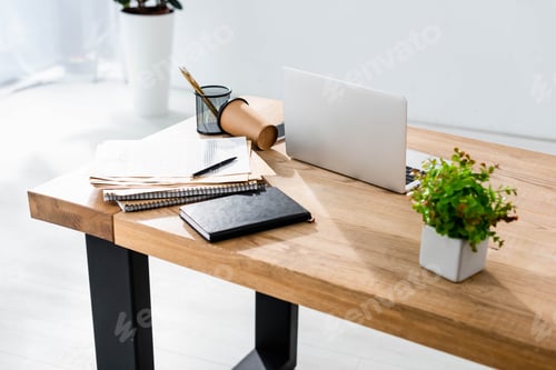 Preview: Workplace with laptop, stationery and coffee to go