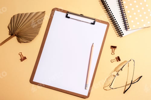 Preview: Desktop with blank clipboard, notepads, fan leaf, eyeglasses and accessories