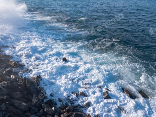 Preview: Rocky beach with Atlantic Ocean waves meeting with underwater sharp rocks