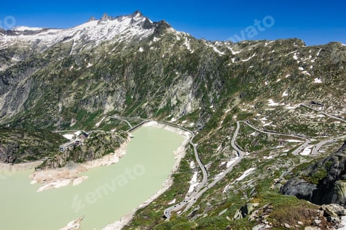 Preview: Aerial view of Lake Grimsel, Hospice and the serpentine road to Grimsel Pass in Switzerland