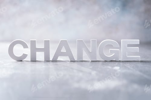 Preview: Word change word made with cement letters on grey marble background. Copy space. Concept