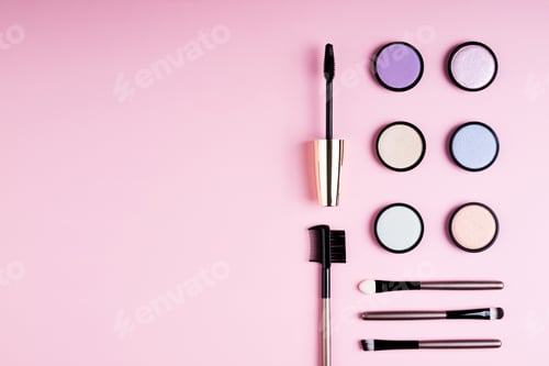 Preview: Cosmetics products for makeup eye eyeshadow, mascara and accessories on pink background