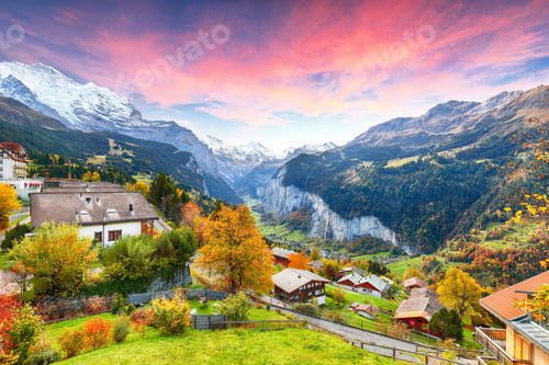 Preview: Stunning autumn view of picturesque alpine village Wengen