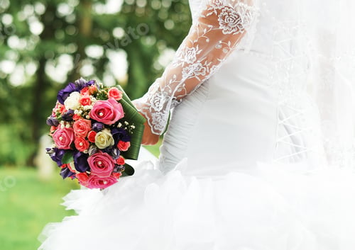 Preview: Bright wedding bouquet of roses for the bride in the hands of the bride close-up