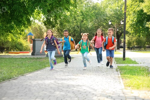 Preview: Cute little children with backpacks running outdoors. Elementary school