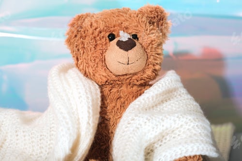 Preview: teddy bear wrapped in warm scarf with snow on a nose. energy crisis in Europe,