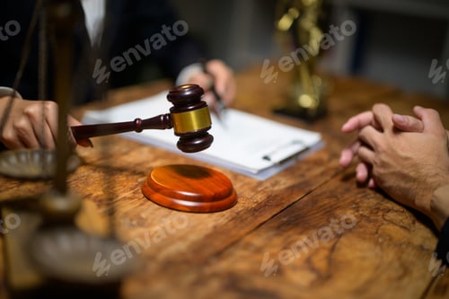 Preview: Judge holding gavel making legal verdict decision