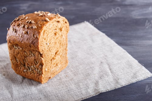 Preview: Cut rye bread on linen napkin.
