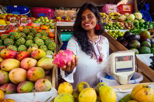 Preview: smiling indonesian business woman in kerala goa sell fruit and vegetable farm