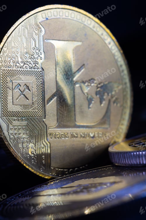 Preview: Vertical closeup of Litecoin on black background. Cryptocurrency.