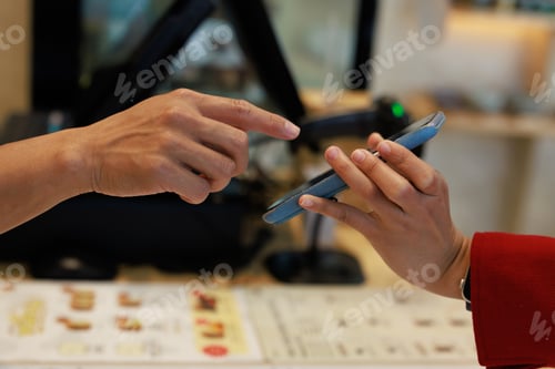 Preview: Customer and staff interacting using digital payment technology