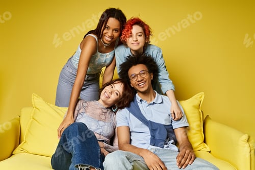 Preview: Sunshine sojourn: diverse group lounging on mustard-coloured couch