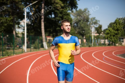 Preview: Young professional sportsman running on treadmill of stadium