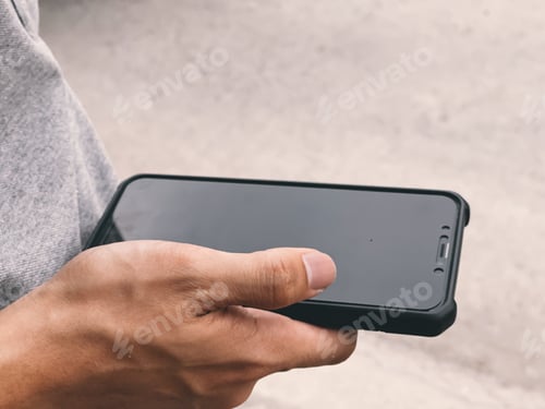 Preview: Close up of a man using mobile smart phone.