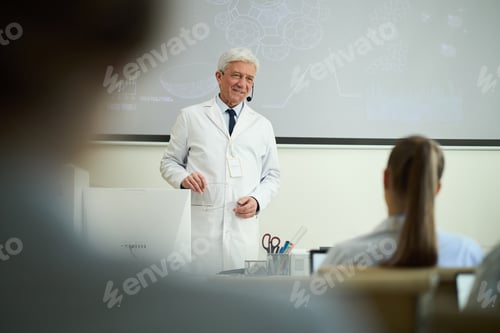 Preview: Senior Scientist Giving Lecture in Laboratory Setting