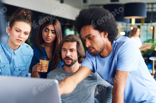 Preview: Group of coworkers working on computer