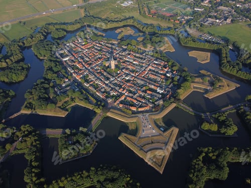 Preview: Scenic aerial view of the Fortress town of Naarden-Vesting surrounded by a tranquil lake