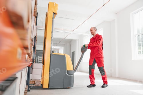 Preview: Man in factory using forklift
