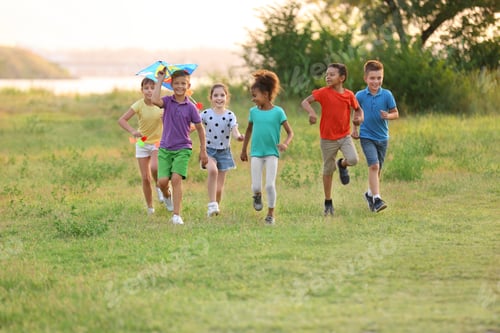 Preview: Cute little children playing with kite outdoors