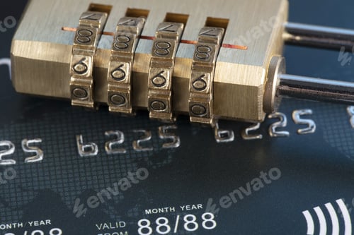 Preview: Closeup shot of a lock on credit cards - credit card data security concept
