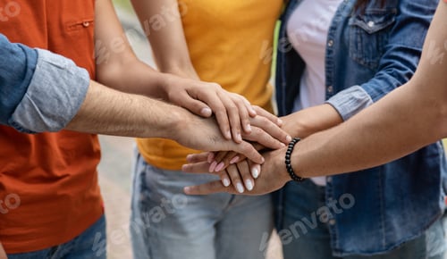 Preview: Teamwork Concept. Group Of Young People Joining Hands Together