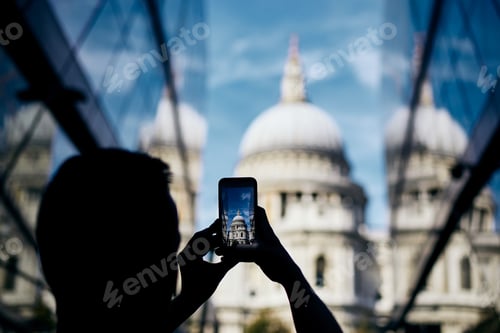 Preview: Man photographing with smart phone