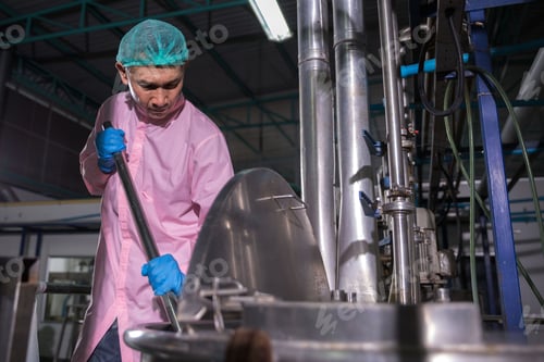 Preview: Worker Checking quality or checking stock of glass bottle in beverage factory.