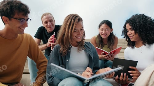 Preview: Group Of Students Studying Together On Steps