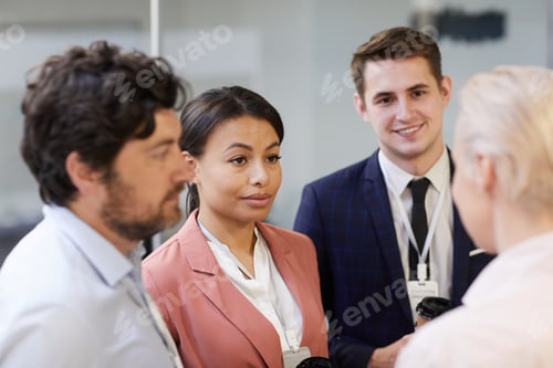 Preview: Business people talking at office