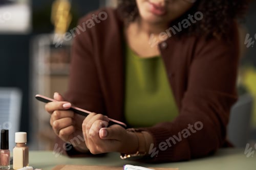 Preview: Businesswoman Making Manicure At Her Workplace