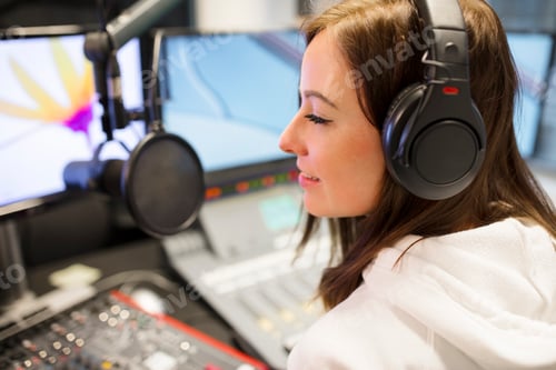Preview: Female Host Wearing Headphones At Radio Studio