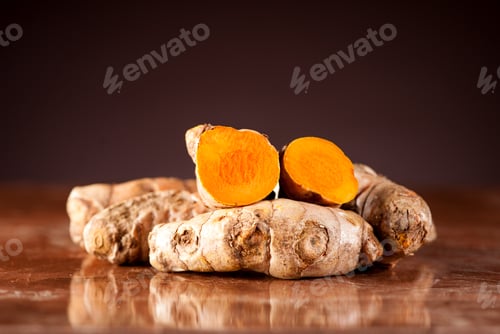 Preview: Fresh root turmeric on a dark background