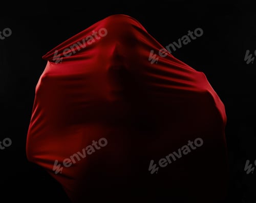 Preview: Human figures trapped in red fabric and struggling to break free while isolated on black