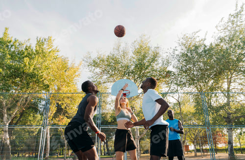 Preview: Teenager group having fun playing basketball