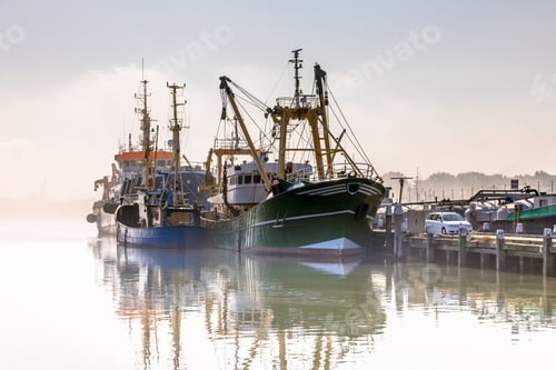 Preview: Modern fishing ships in hazy weather haringvliet