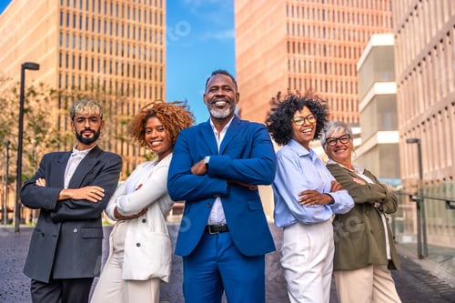 Preview: Portrait of a multi-ethnic business team standing proud outdoors